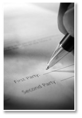 A closeup photo of a pen signing a legal document